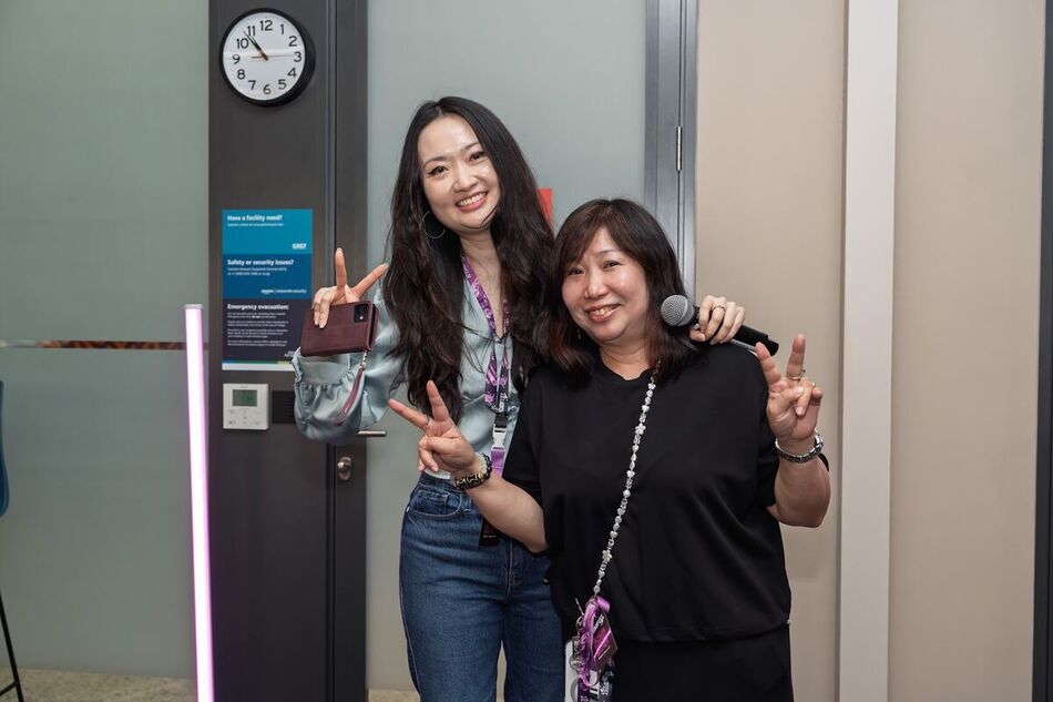 Two attendees posing together during a networking break